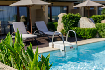 Escape to paradise! Relax by the pool with comfortable loungers and stunning resort views. Book your getaway today!