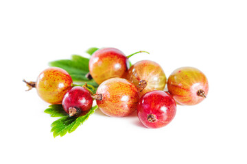 Ripe gooseberries with leaves isolated on white.