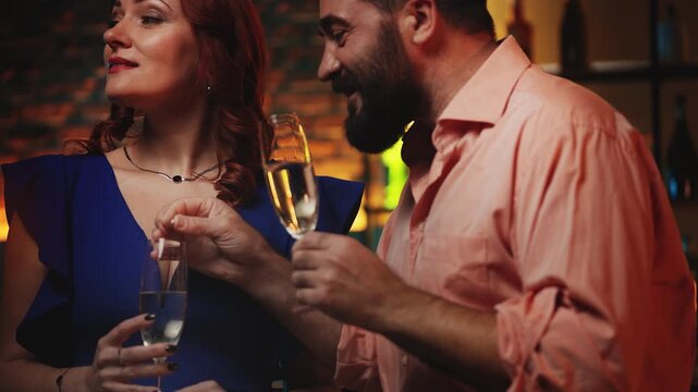 Dishonest man secretly adding drugs into woman's cocktail during date at bar