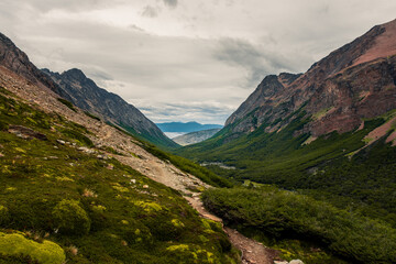 Steep climb through jagged rocks under clear blue Patagonian sky
