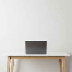 Minimalist workspace with a modern laptop computer on a wooden desk against a clean white wall, providing ample copy space