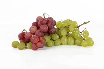 Bunches of red and green grapes on a white background