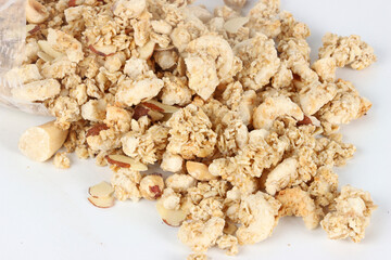 Muesli cereal with almonds and nuts on a white background