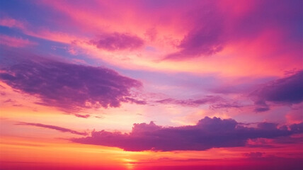 Naklejka premium Stunning vibrant sunset paints sky with dramatic pink and purple clouds, evoking peace and wonder.