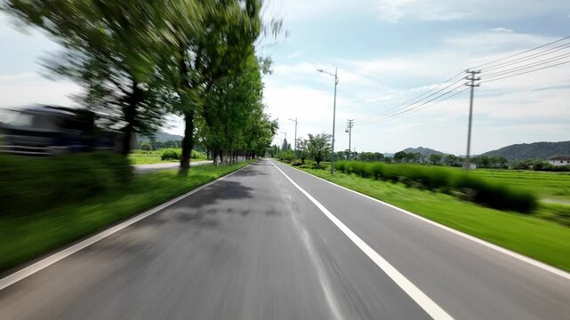 drving through road in countryside,pov