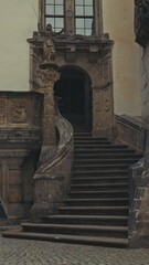 Historic stone staircase with ornate sculptures and reliefs in G&ouml;rlitz, Germany. Detail of Renaissance architecture and cultural heritage in the old town.