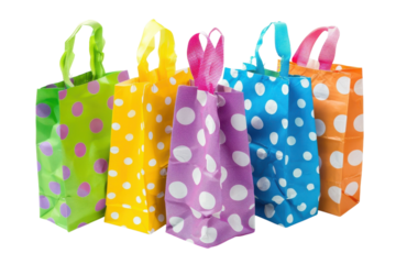Vibrant polka-dotted gift bags in an array of colors brighten any celebration or special occasion, perfect for wrapping treasures lovingly isolated on transparent background
