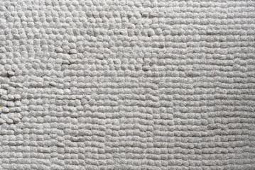 Close-up of a textured gray rug.