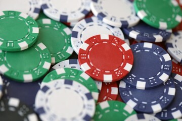 Poker Table With Poker Chips Turns In Casino. Many Poker Chips Spins on the Table