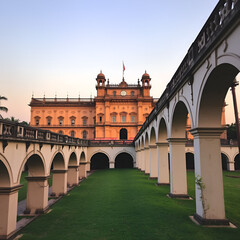 Fototapeta premium Chepauk Palace exterior and leading arched walls in foreground,Chennai,Tamil Nadu,India.