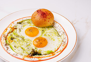 Delicious breakfast dish featuring eggs and flavorful greens on a plate