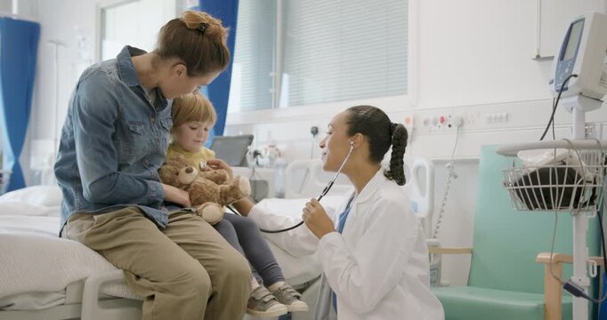 Child with Doctor and Mother, Medical Exam in Doctor's Office