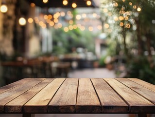 Empty wooden table outdoors, blurred background of cafe