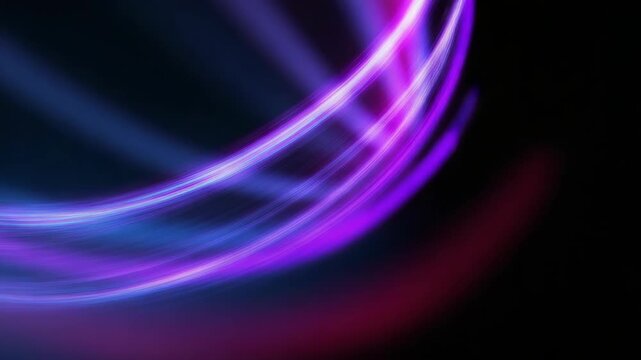 Vibrant neon light trails swirling in dynamic motion against dark background