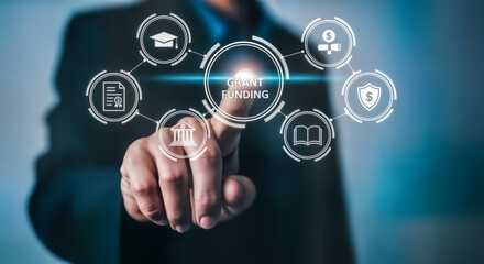 Businessman touching a digital interface with icons representing various aspects of grant funding, including education, finance, and legal documents