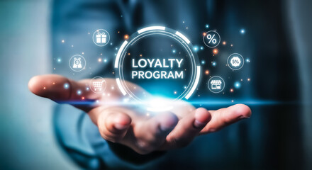Hand holding glowing circle with text loyalty program and icons representing rewards, discounts, and customer engagement, symbolizing a successful customer retention strategy and business growth