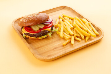 Perfect hamburger, classic burger, american cheeseburger with cheese and fries.