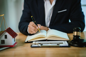 A gavel symbolizes law, justice, and authority in business and real estate auctions, representing contracts, ownership, finance, property sales, and legal agreements.