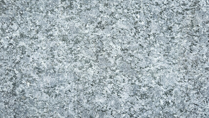 Gray granite marble stone texture background, natural rock surface with rough details and speckled pattern, perfect for architecture, construction, design projects, or abstract decorative backdrops.
