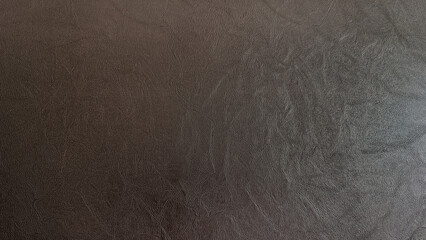 Dark brown leather texture background with natural wrinkles and subtle shine, ideal for upholstery,...