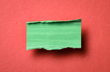 One single green torn ripped wrinkled crumpled blank paper note with drop shadow, folded edge and...