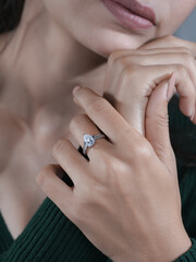 woman elegant finger ring with white diamond