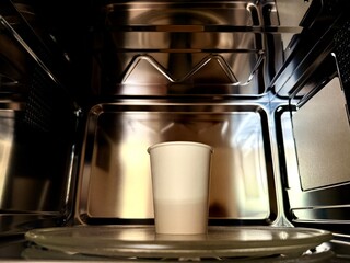 White Paper Cup Inside Clean Modern Microwave – Hispanic Office Context