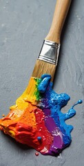 Paintbrush Dipped in Rainbow-Colored Acrylic Paints