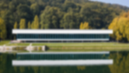 Fototapeta premium blurry photo of a school building located on the edge of a lake with a view overlooking the lake, Evergreen, blur wallpaper.