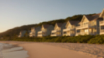 Fototapeta premium Blurry photo of a modern villa on the beach facing directly to the sea, Evergreen theme, blurry wallpaper.