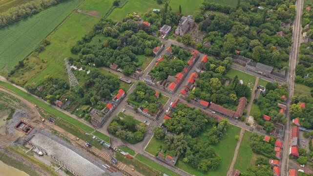 Drone footage over deserted Doel ghost town by river Scheldt, Belgium