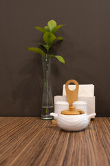 Create an Elegant and Inviting Table Decor Featuring a Ceramic Pot and Fresh Green Leaves