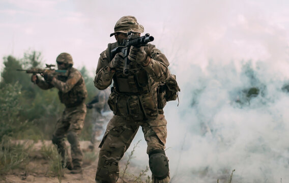 Russian-8 Jun 2025-War Concept. Historical reconstruction, soldiers fighting during World War II. Selective focus.Soldiers in desert terrain, wearing tactical gear and camouflage. Engaged in military.