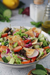 A bowl with Fattoush - Traditional Levantine salad	