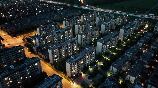 Drone Aerial Night Video of Residential Apartments with City Lights