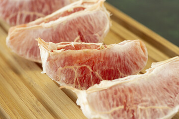 healthy grapefruit slices on a board