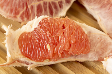 grapefruit slices on wooden background