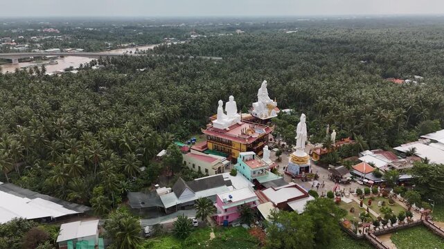 Lien Hoa Pagoda, My Tho, Dong Thap, Vietnam: 4K Aerial Drone Footage of Buddhist Temple, Giant Statues, Coconut Palm Forests and the Mekong River Delta