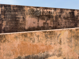 textured old walls and blue sky
