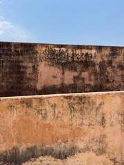 textured old walls and blue sky