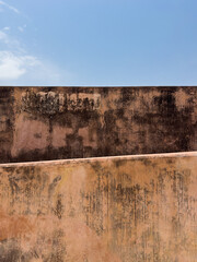 textured old walls and blue sky