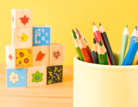 Colorful wooden blocks and crayons