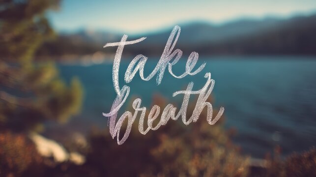 High quality photo of take a breath inspirational quote over a serene nature scene.