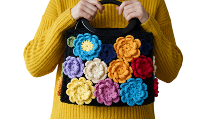 Handwoven bag templates woman in yellow sweater holding a black crochet handbag with colorful flowers isolated on transparent background