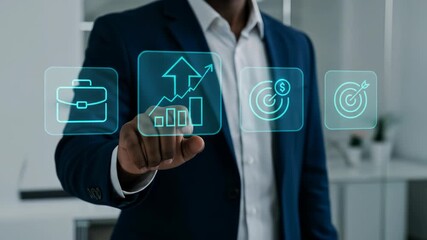 Business Growth: Professional Black man in his 30s tapping virtual infographic on office interface for strategic planning success. - Powered by Adobe