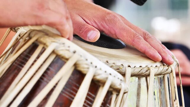 Musician playing tabla drums during a concert in India