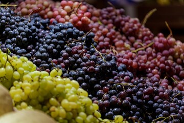 Fresh grapes in different colors displayed in supermarket