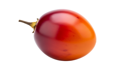 A single tamarillo fruit is displayed against a stark isolated background, with a gradient of color shifting from deep red to bright orange.