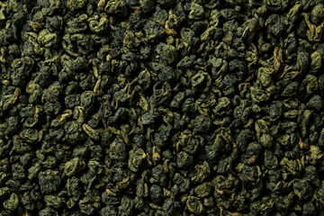 Milk Oolong tea, close-up of aromatic Chinese rolled tea leaves