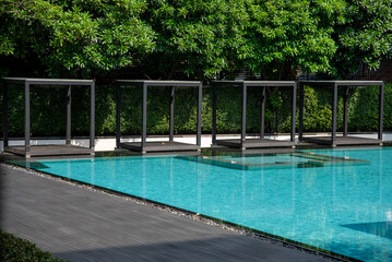 Modern Sofa and furniture on rooftop swimming pool.